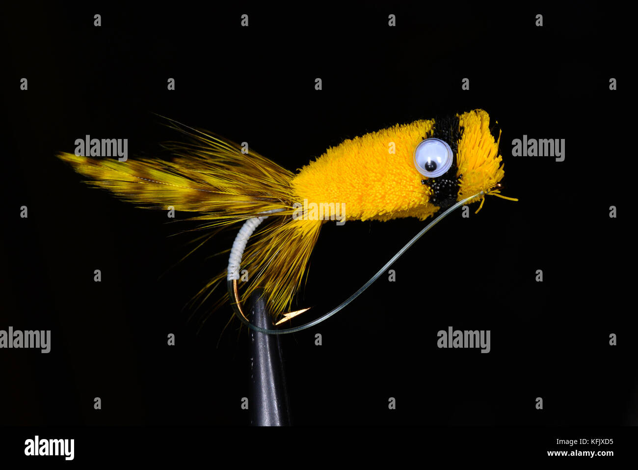 Yellow deer hair popper used for fly fishing for bass. Stock Photo