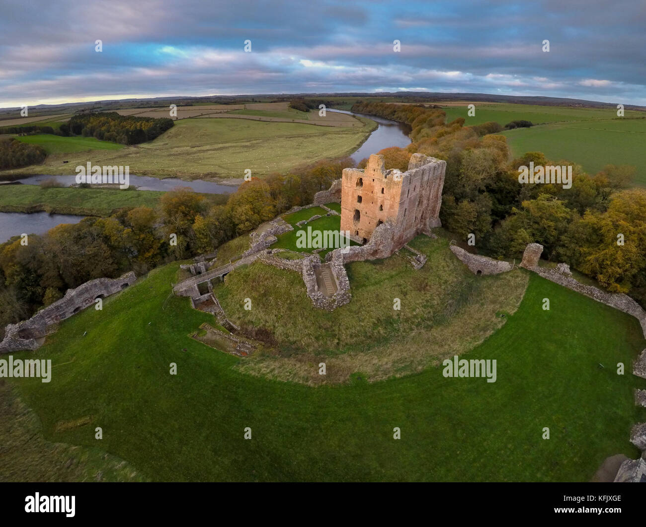 Aerial view of the Scottish Border with Norham Castle standing guard on the English side of the border on the River Tweed Stock Photo