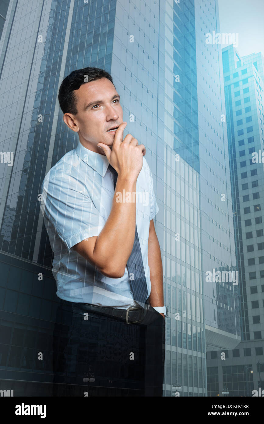 Nice handsome man having a thoughtful look Stock Photo - Alamy