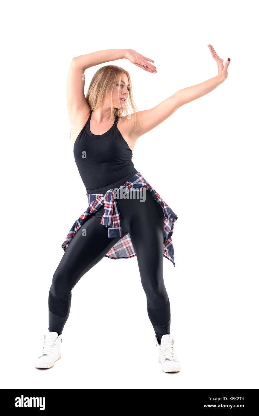 Attractive jazz dance or dancehall female dancing with arms up looking