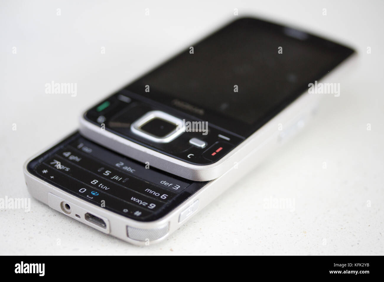 An old style Nokia N96 mobile phone. Stock Photo