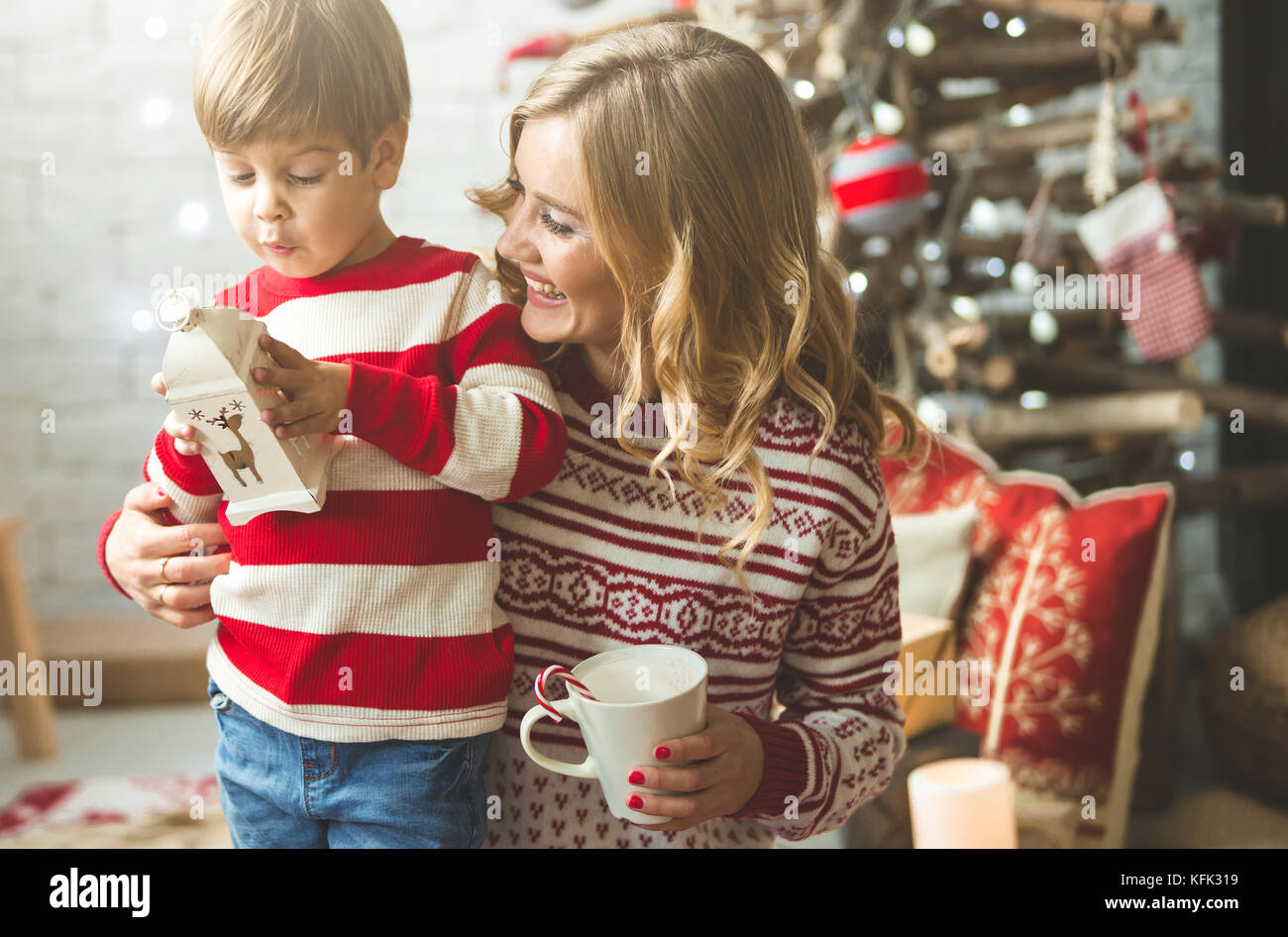 Portrait of happy mother and son on the background of the Christmas