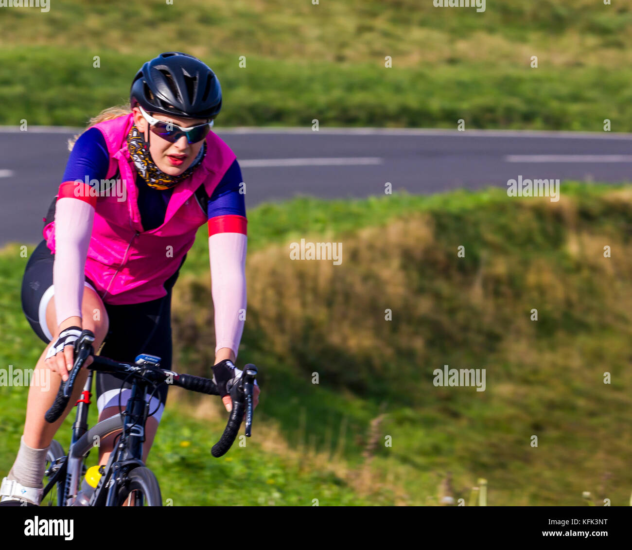 Female cyclist in country park area Stock Photo Alamy