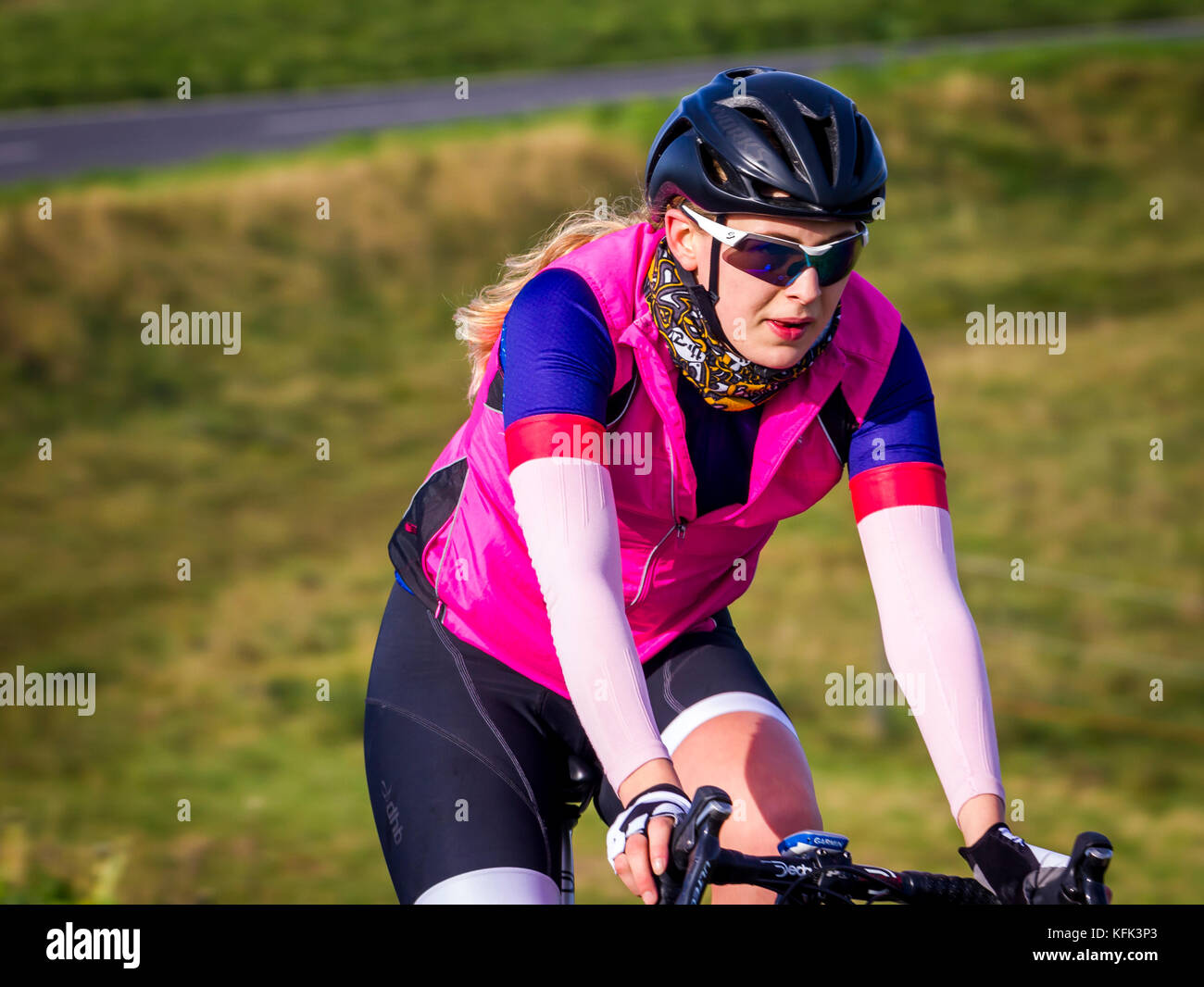 Female cyclist in country park area Stock Photo Alamy