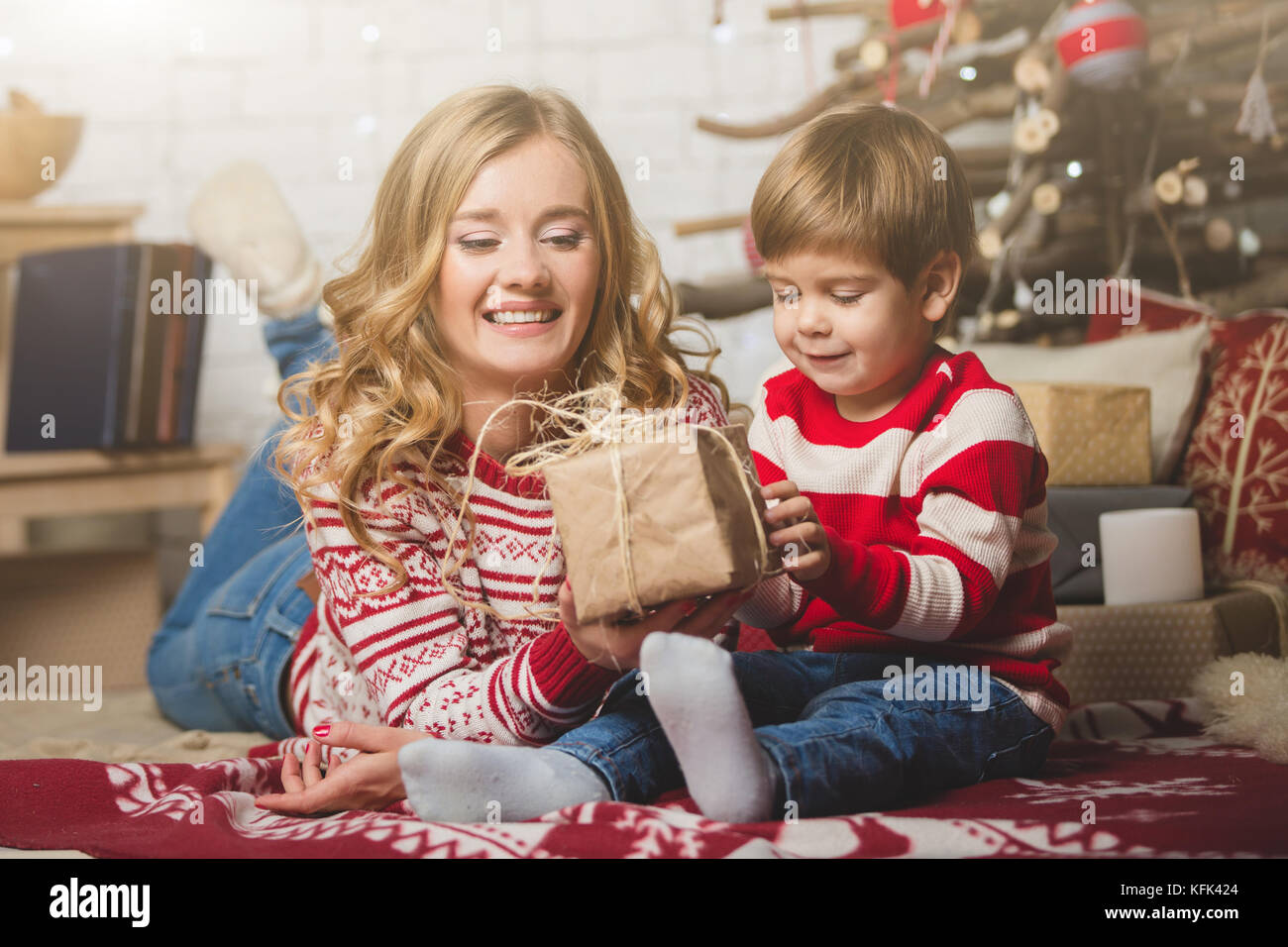 Portrait of happy mother and son on the background of the Christmas