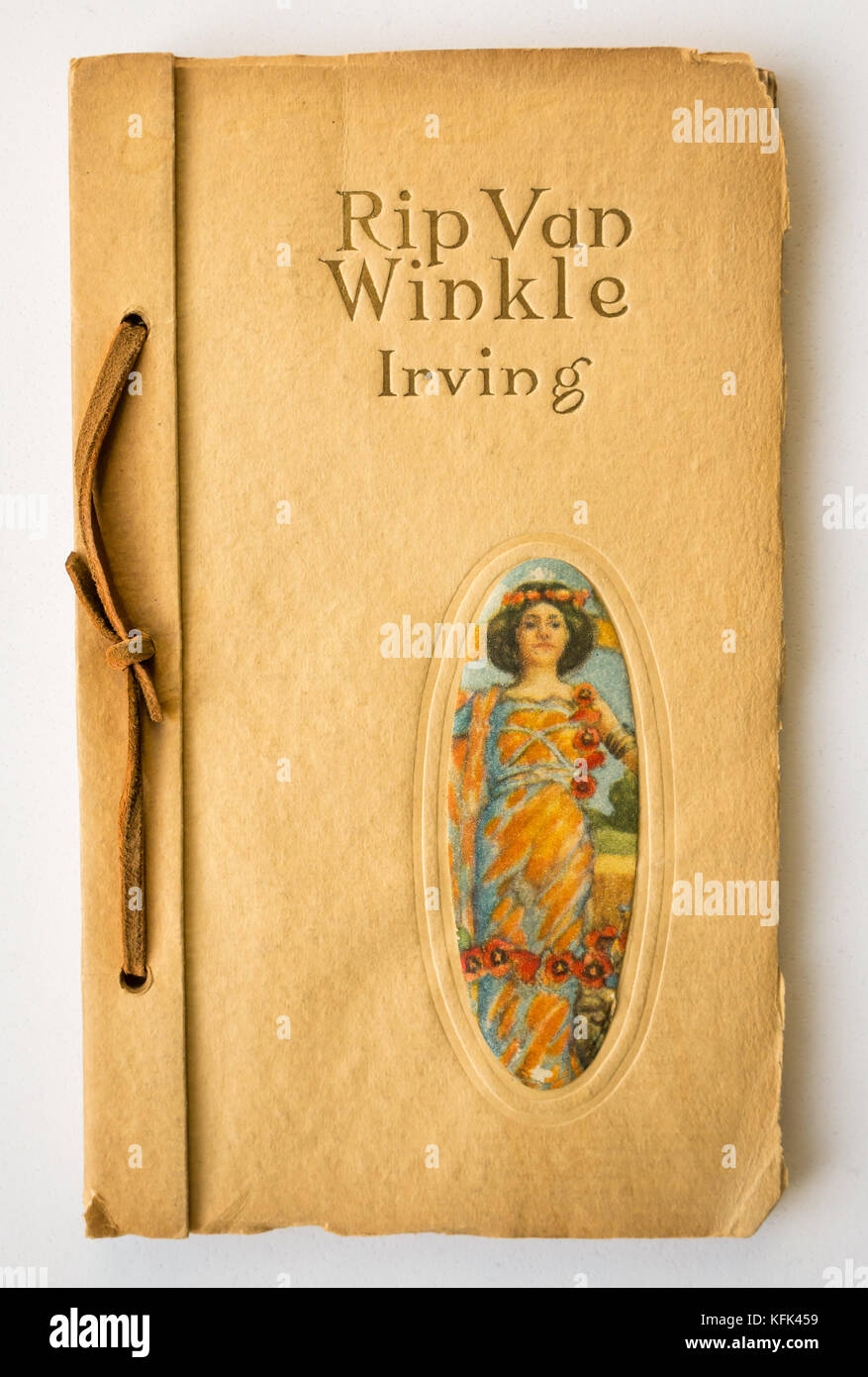 Early 20th century American hand bound paper cover book with leather cord, Rip Van Winkle by Washington Irving with front cover colour illustration Stock Photo
