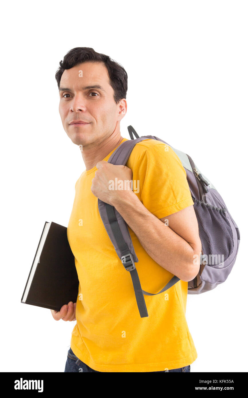 Student going to class. College. Proof. Entrance exam. Studies. Conquest. He is wearing a yellow jersey. Isolated on white background. He is holding a Stock Photo