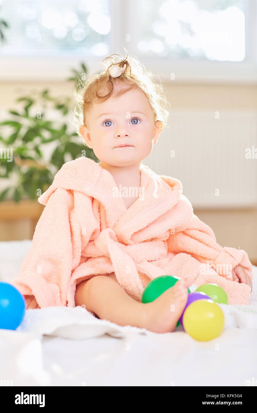 Baby cute in the bathrobe after the bath Stock Photo