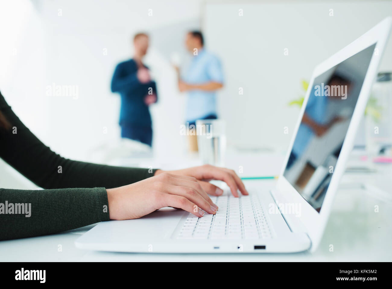 Girl works on a laptop. Concept of internet sharing and interconnection Stock Photo