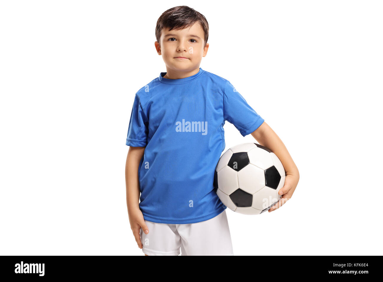 Little footballer looking at the camera isolated on white background Stock Photo