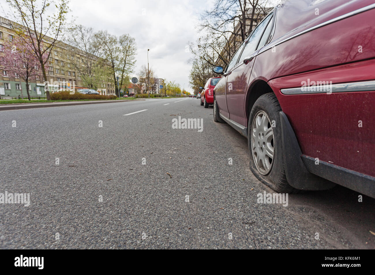 Car with flat tire Stock Photo