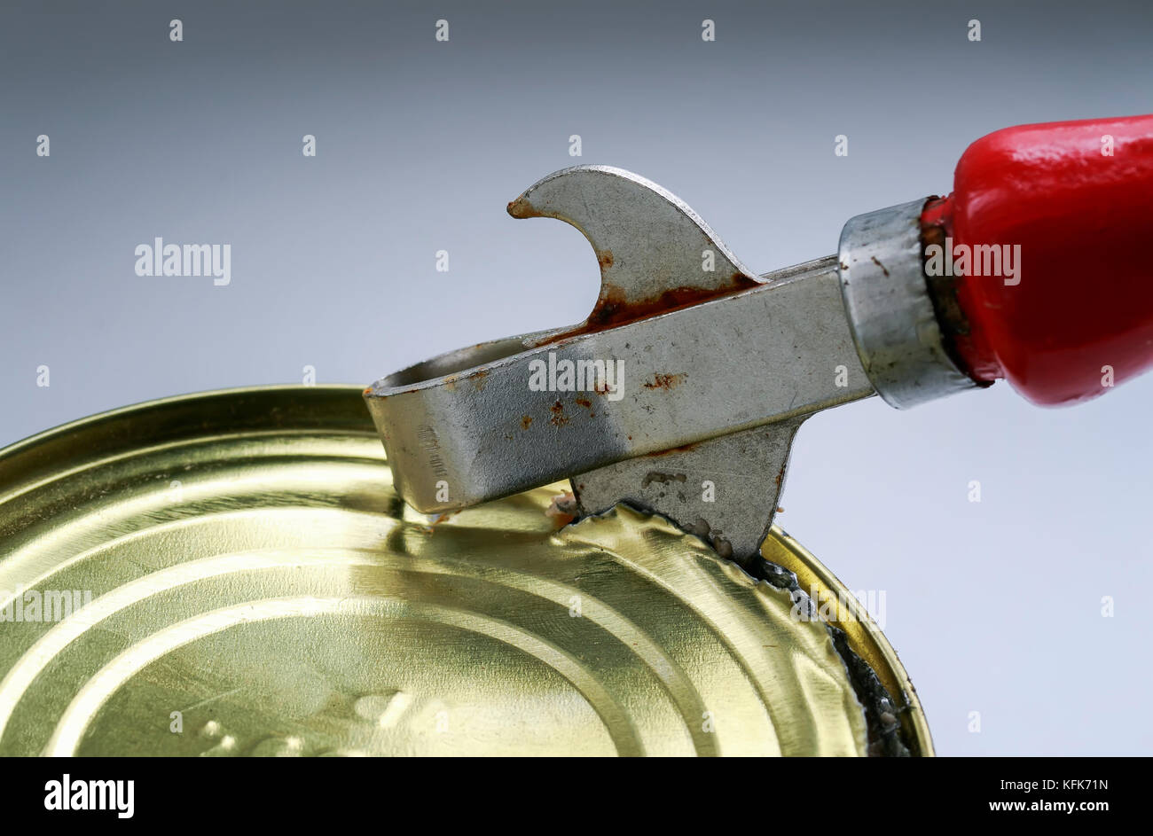 Old Rusty Can Opener Tile Table Stock Photo by ©andreyrut 410815742