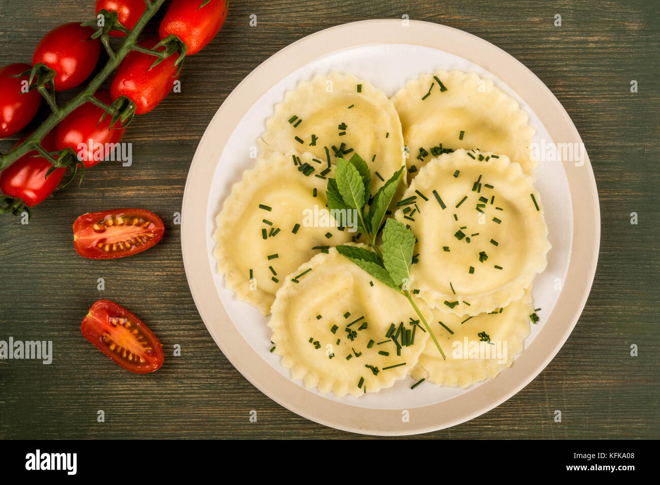 Italian Style Cappelletti With Parma Ham Ravioli Pasta On A Green Wooden Background Stock Photo