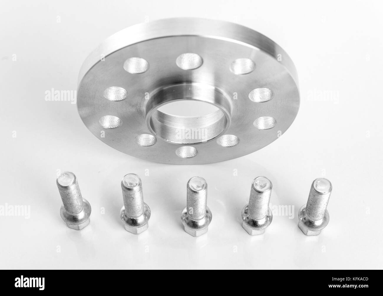 Spacers to increase the wheelbase of the car on a light background