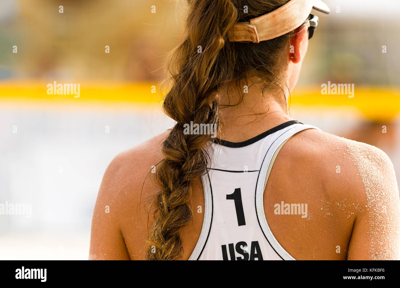 Volleyball beach serving is a female beach volleyball player getting