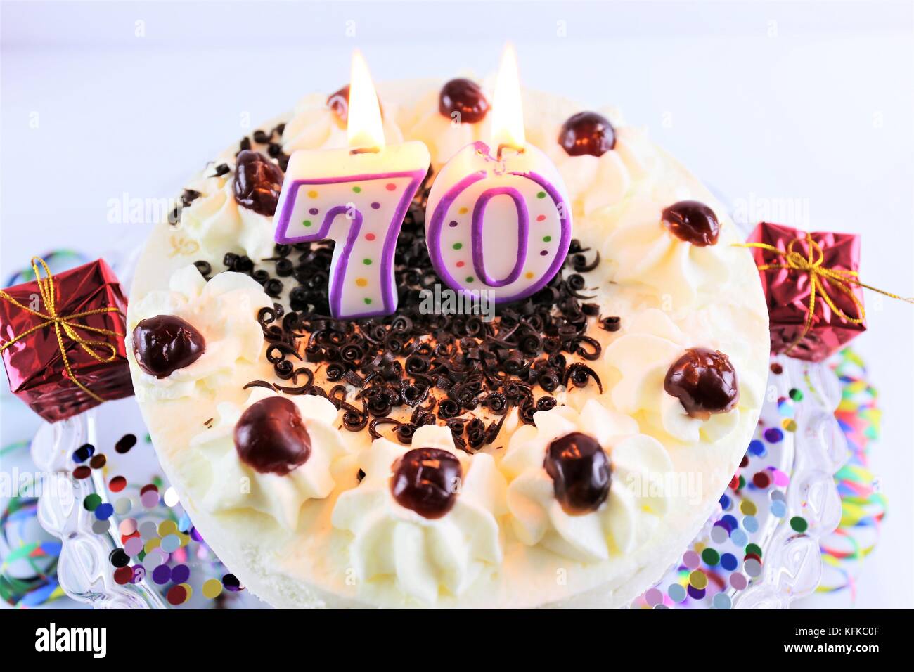 An image of a birthday cake with candle - 70 Stock Photo