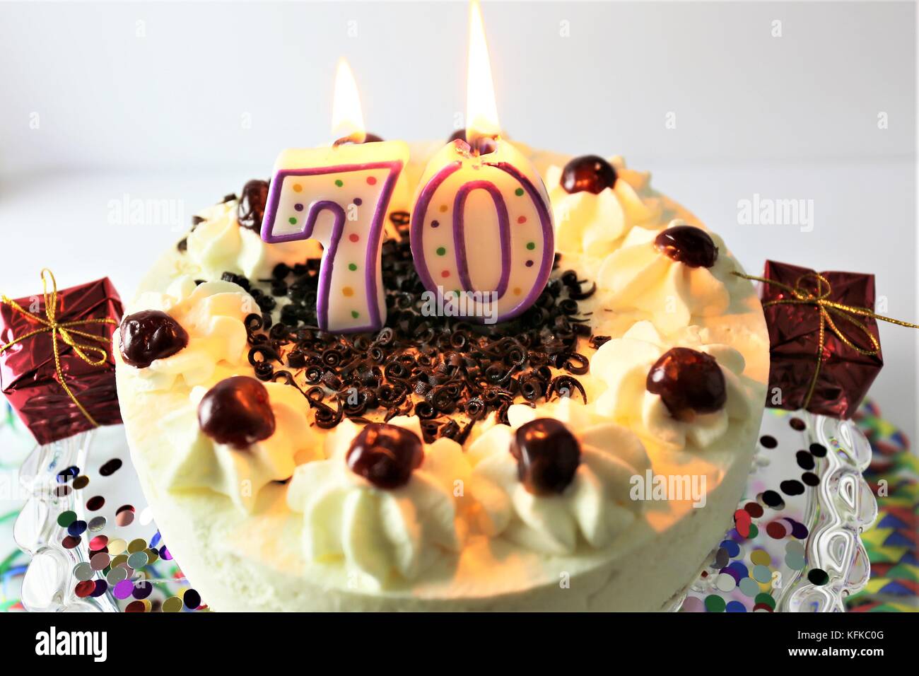 An image of a birthday cake with candle - 70 Stock Photo