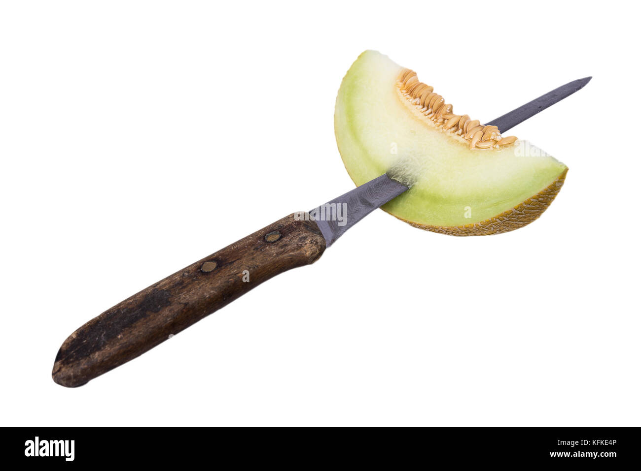 Fresh one slice of yellow melon or cantaloupe stick on the old knife