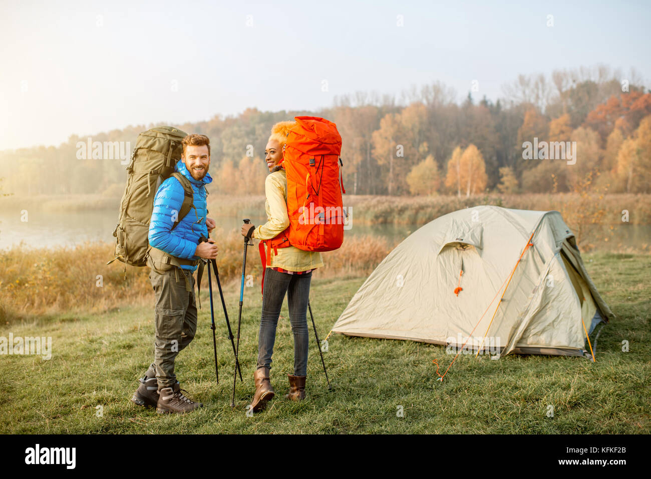 Couple hiking with backpacks Stock Photo