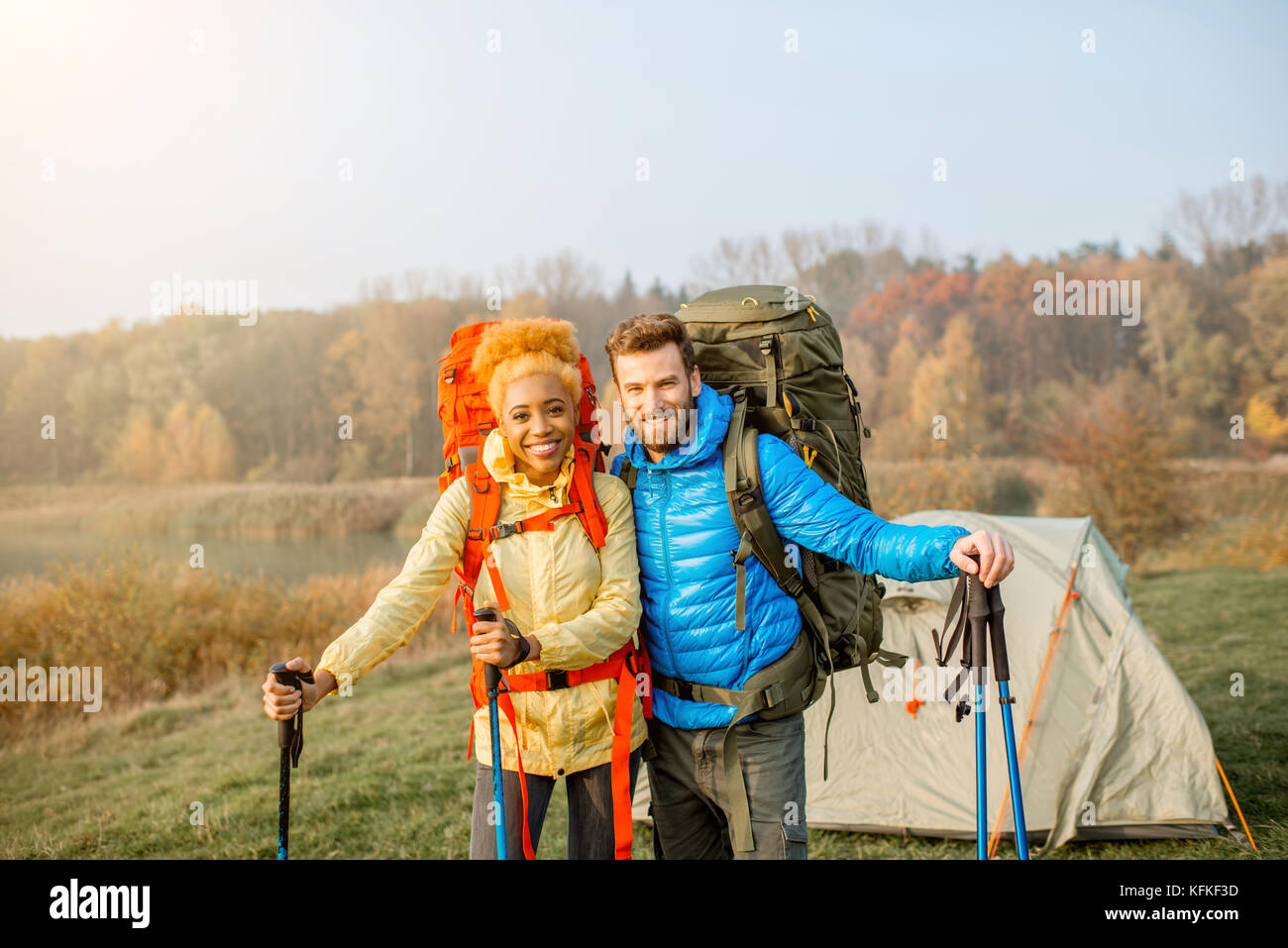 Couple hiking with backpacks Stock Photo