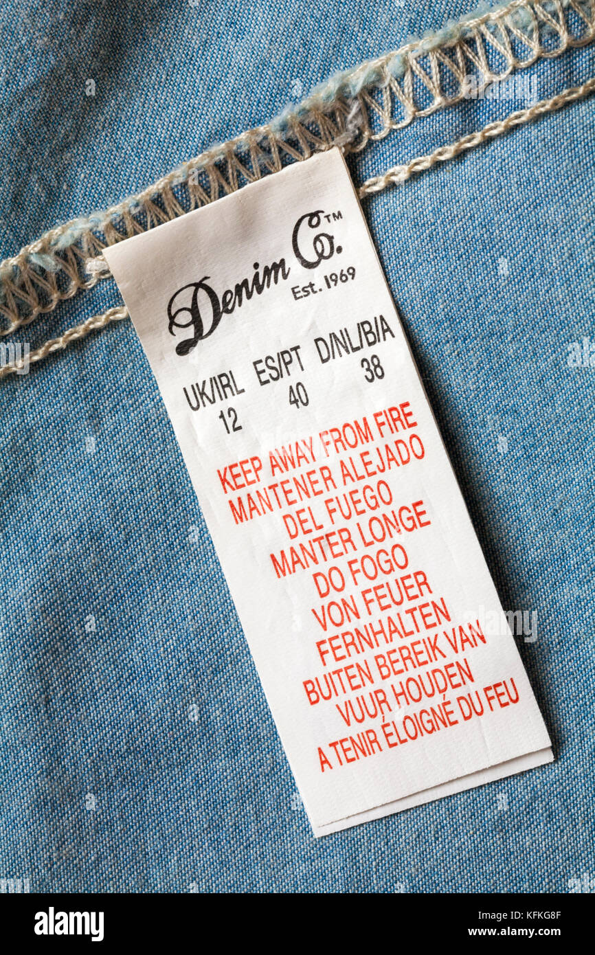 away from fire in many different languages in Denim Co top Stock Photo -