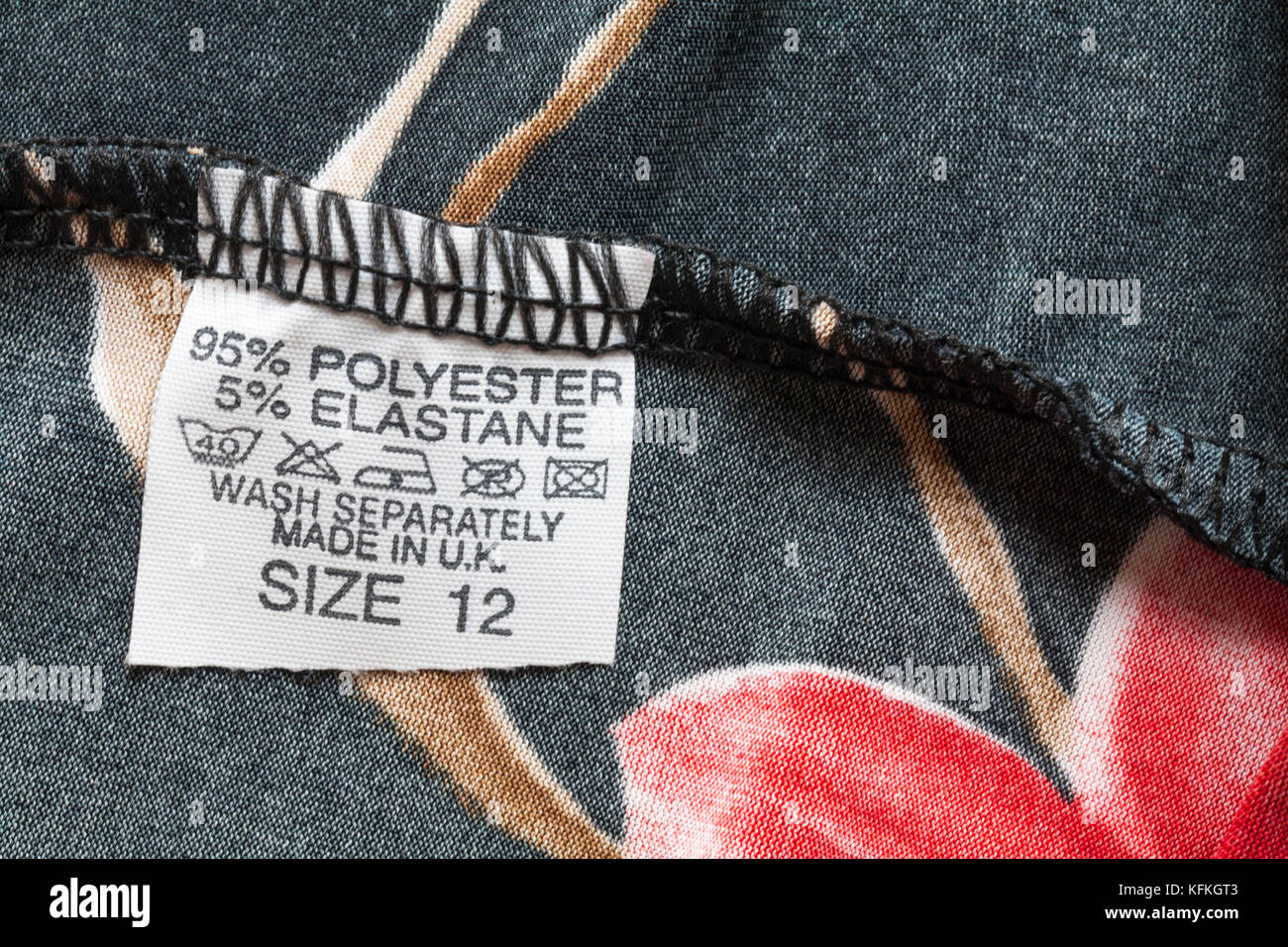 96% polyester 5% elastane label in woman's top size 12 made in U.K. with wash care symbols Stock Photo