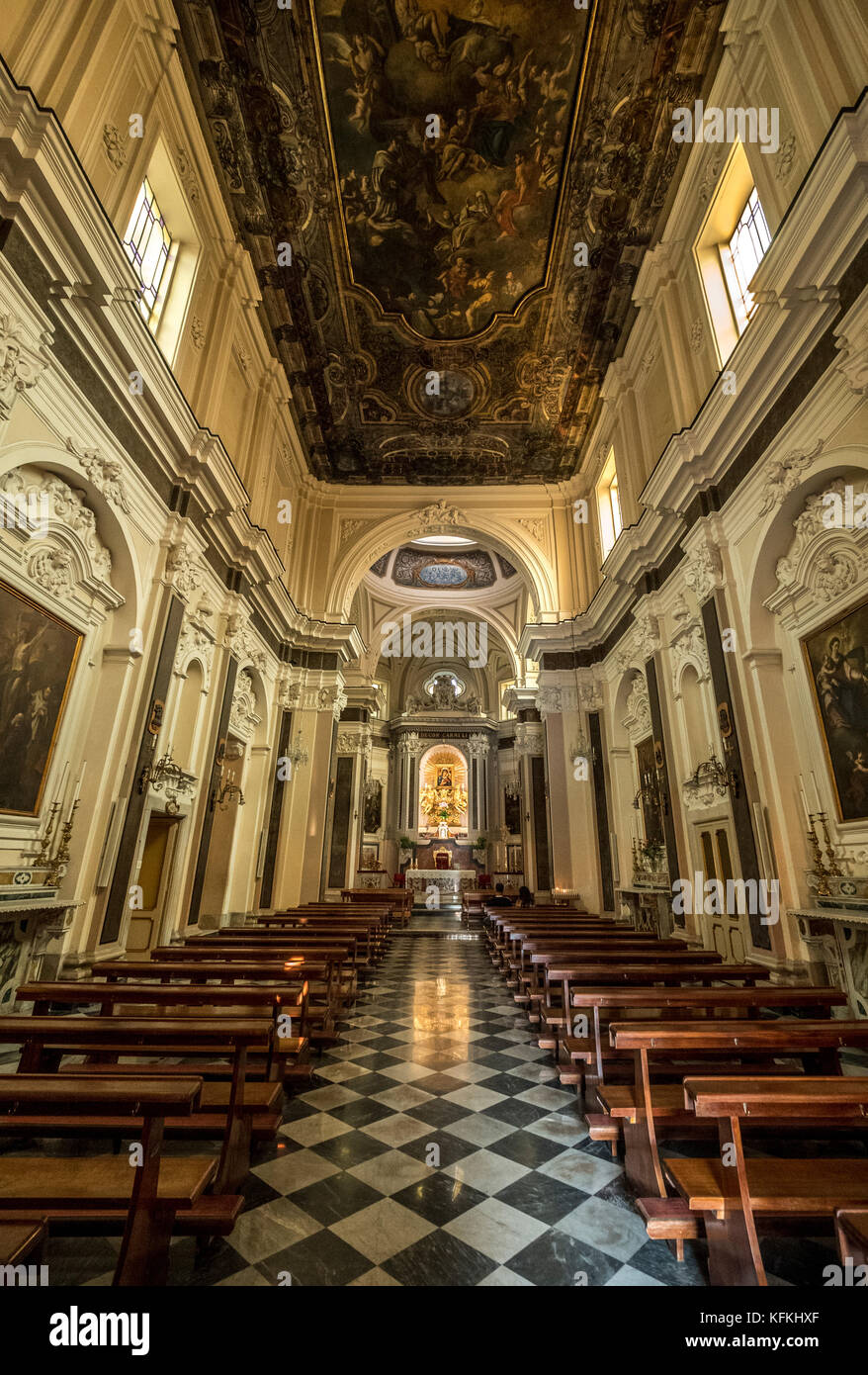 Interior aisle and wooden pews of Santuario Della Madonna Del Carmine, Piazza Tasso, Sorrento, Italy. Stock Photo