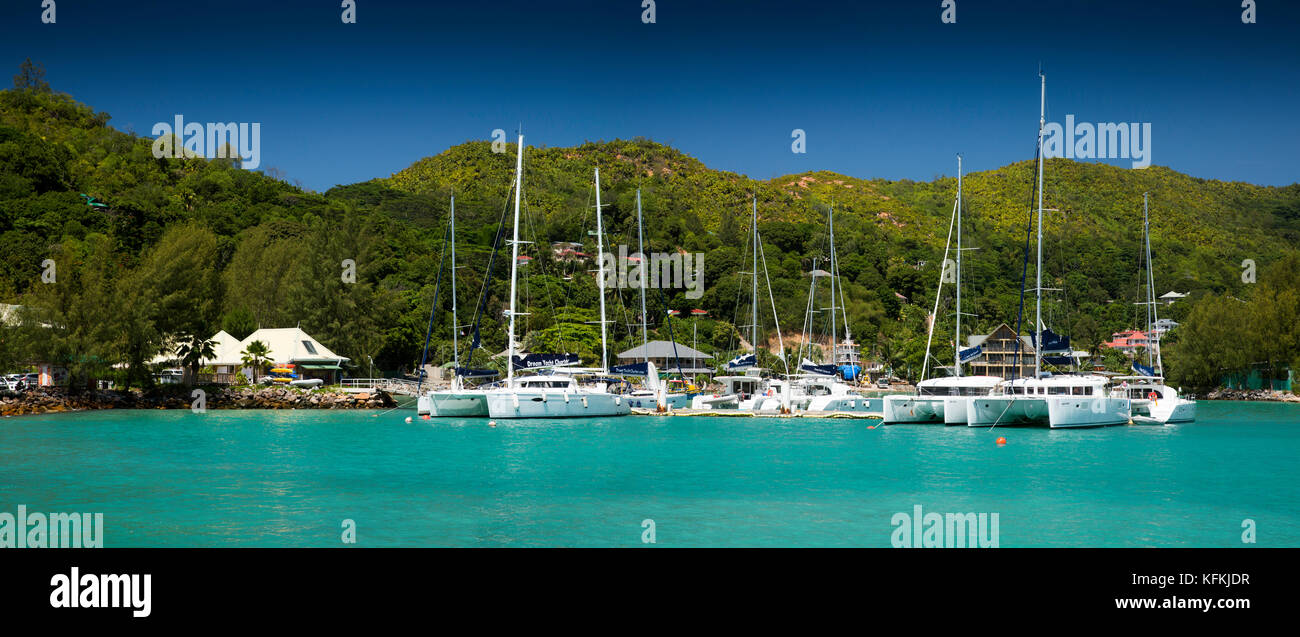 The Seychelles, Praslin, Baie St Anne, jetty, charter boats moored in sheltered harbour