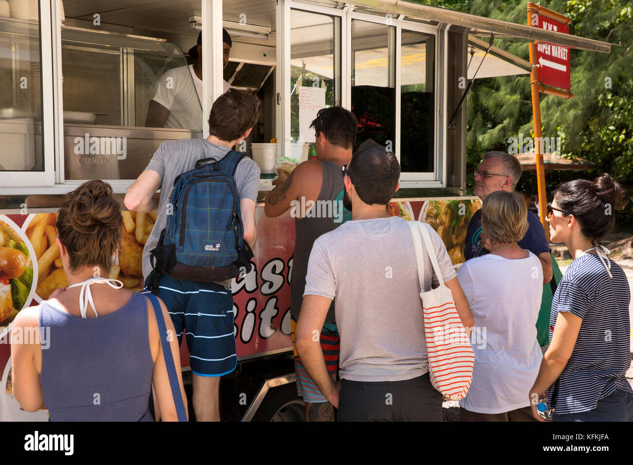 The Seychelles, Praslin, Anse Volbert, Esplanade, lunchtime customers outside takeaway food van Stock Photo