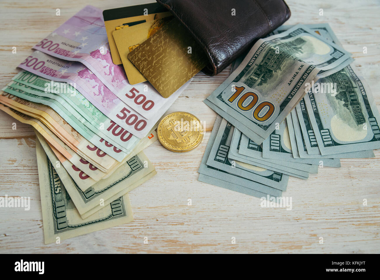 money euro dollars and bitcoin with wallet and bank cards Stock Photo -  Alamy