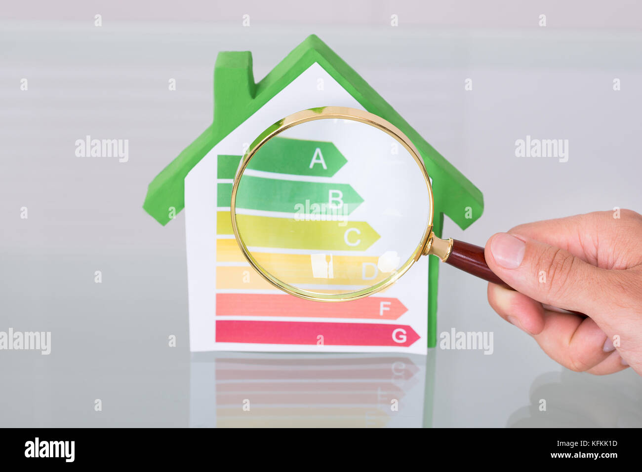 Inspecting new eco friendly house using magnifying glass Stock Photo ... - Certified Luxury Eco Friendly Home Inspectors
