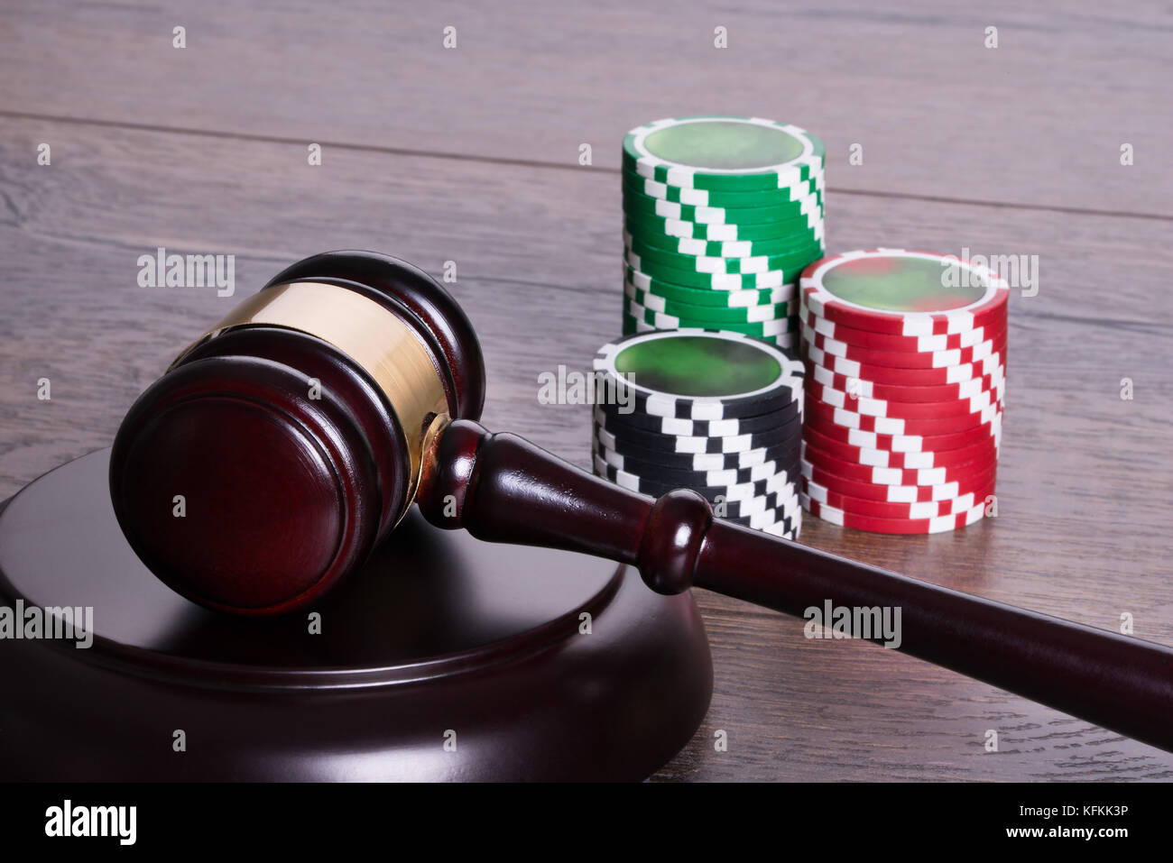 Casino chips and gavel in gambling legal concept Stock Photo