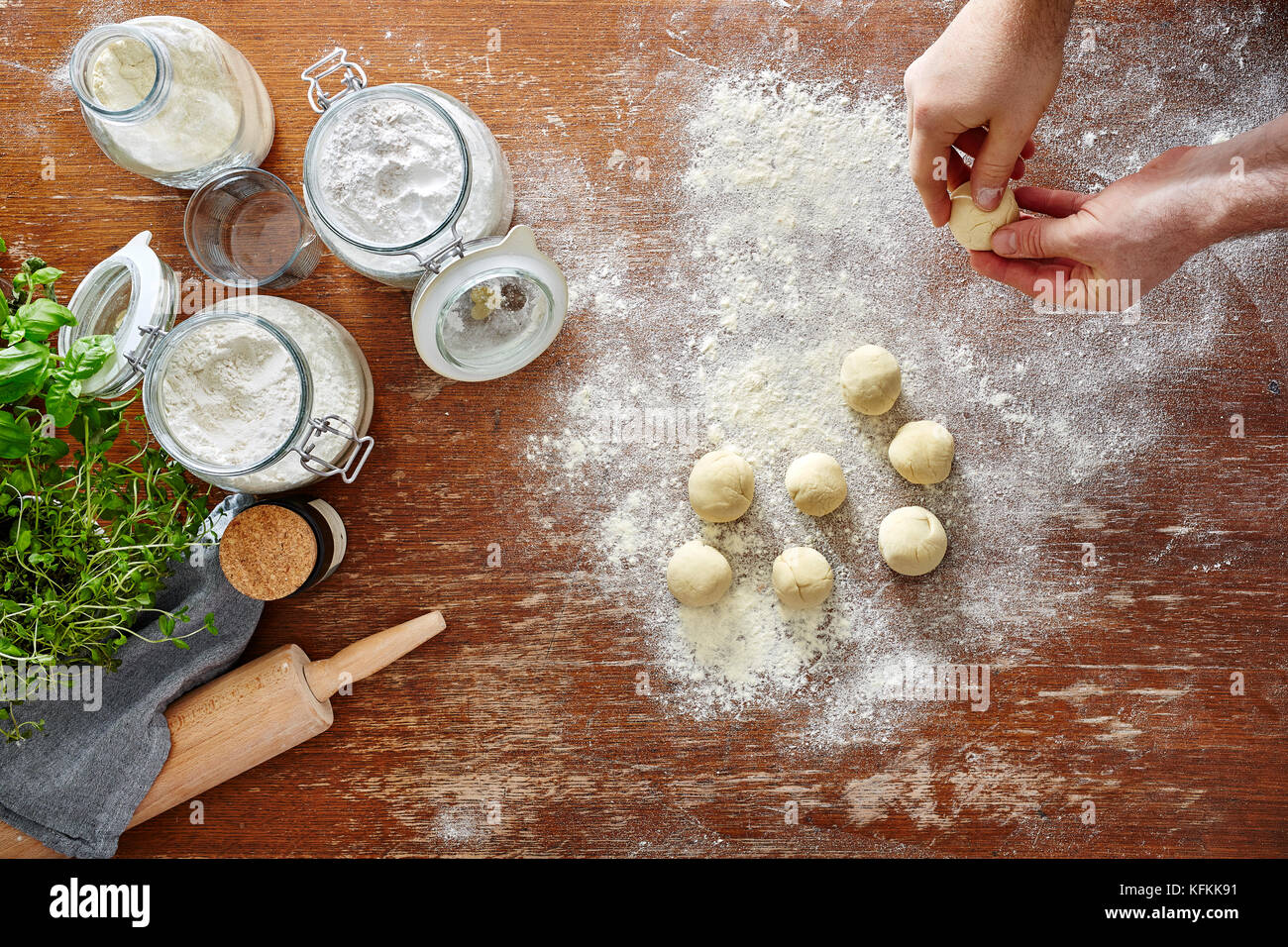 View of homemade pasta baking in kitchen hands forming dough Stock Photo - Alamy