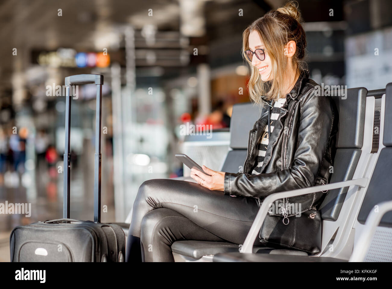 Woman at the airport Stock Photo - Alamy