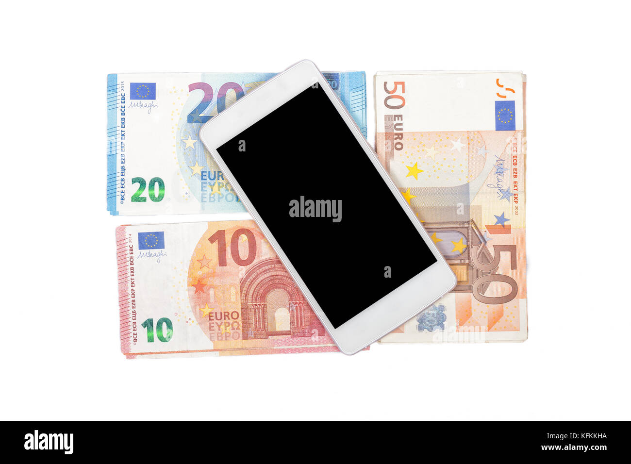 Money and phone on white background. Stock Photo