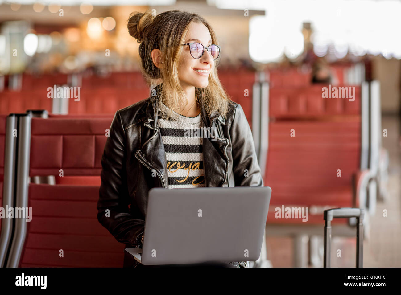Woman at the airport Stock Photo - Alamy