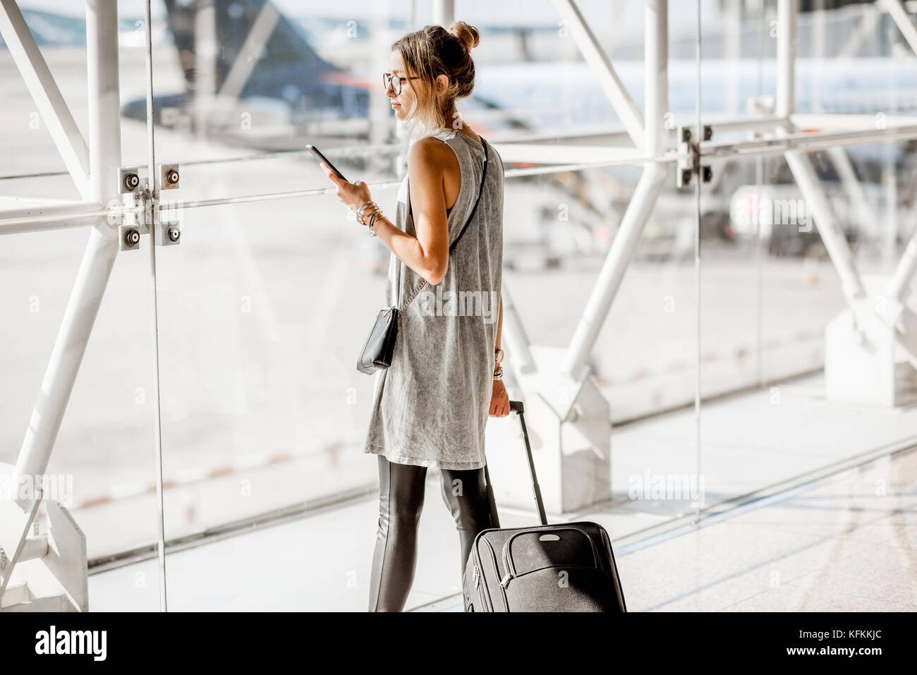 Woman at the airport Stock Photo - Alamy