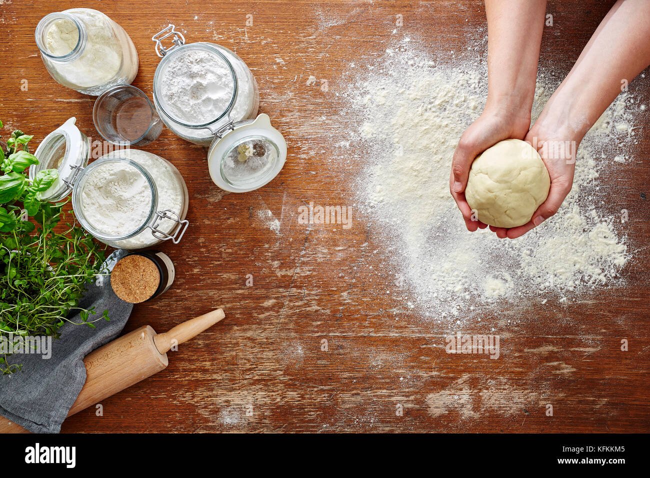hands forming dough atmospheric kitchen scene Stock Photo