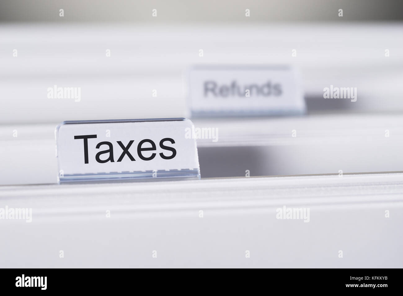 Closeup of Taxes and Refunds tabs on folders Stock Photo - Alamy