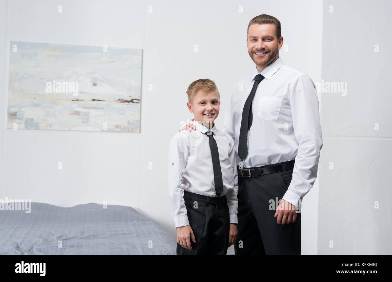 father and son in formal wear Stock Photo Alamy
