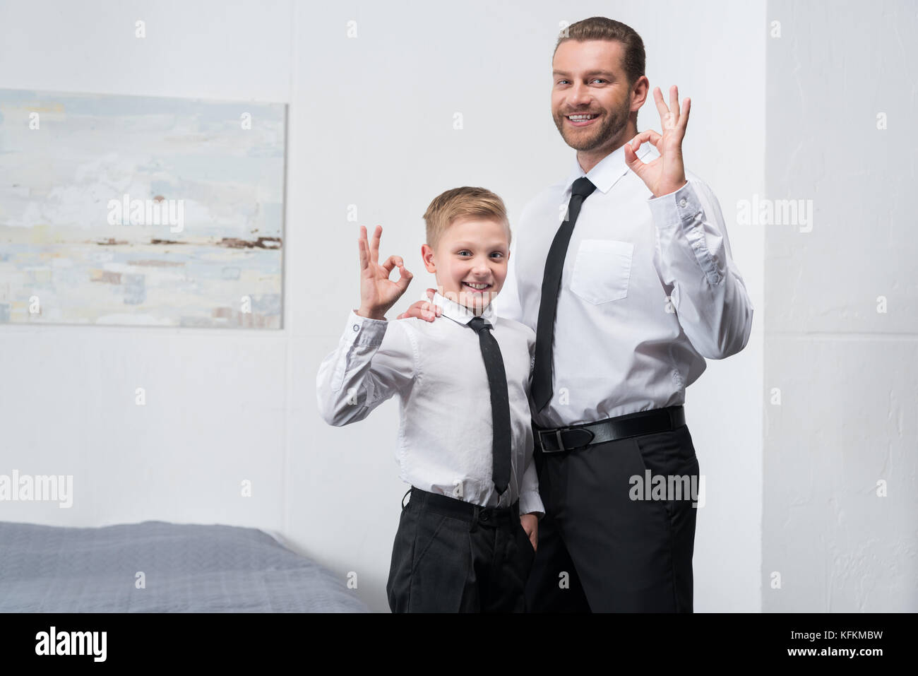 father and son in formal wear Stock Photo Alamy