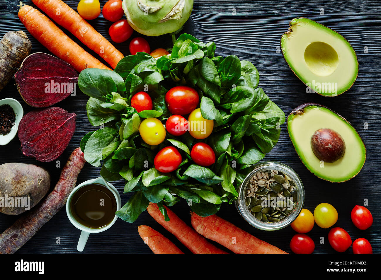 fresh organic salad with avocado beetroot carrots and tomatoes Stock Photo