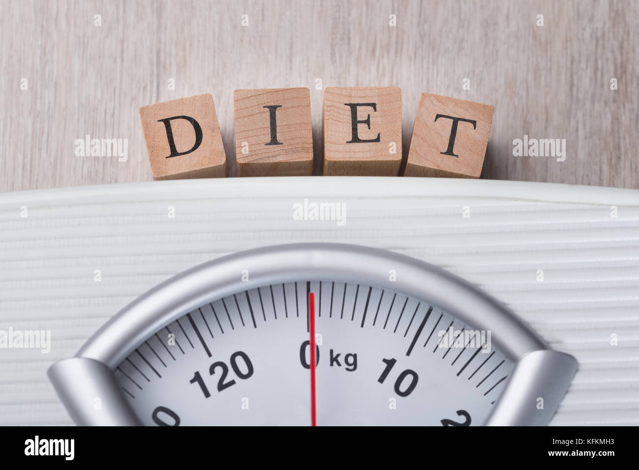 Closeup of weight scale indicating Diet wooden blocks Stock Photo