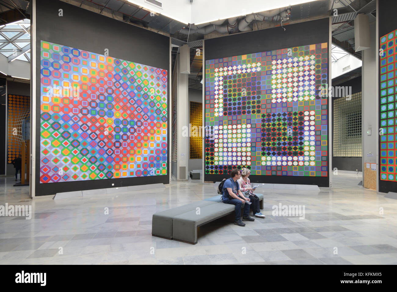 Two Tourists or Visitors in Art Gallery Interior of the Vasarely Foundation or Fondation Two Tourists or Visitors in Art Gallery Interior of the Vasarely Foundation or Fondation