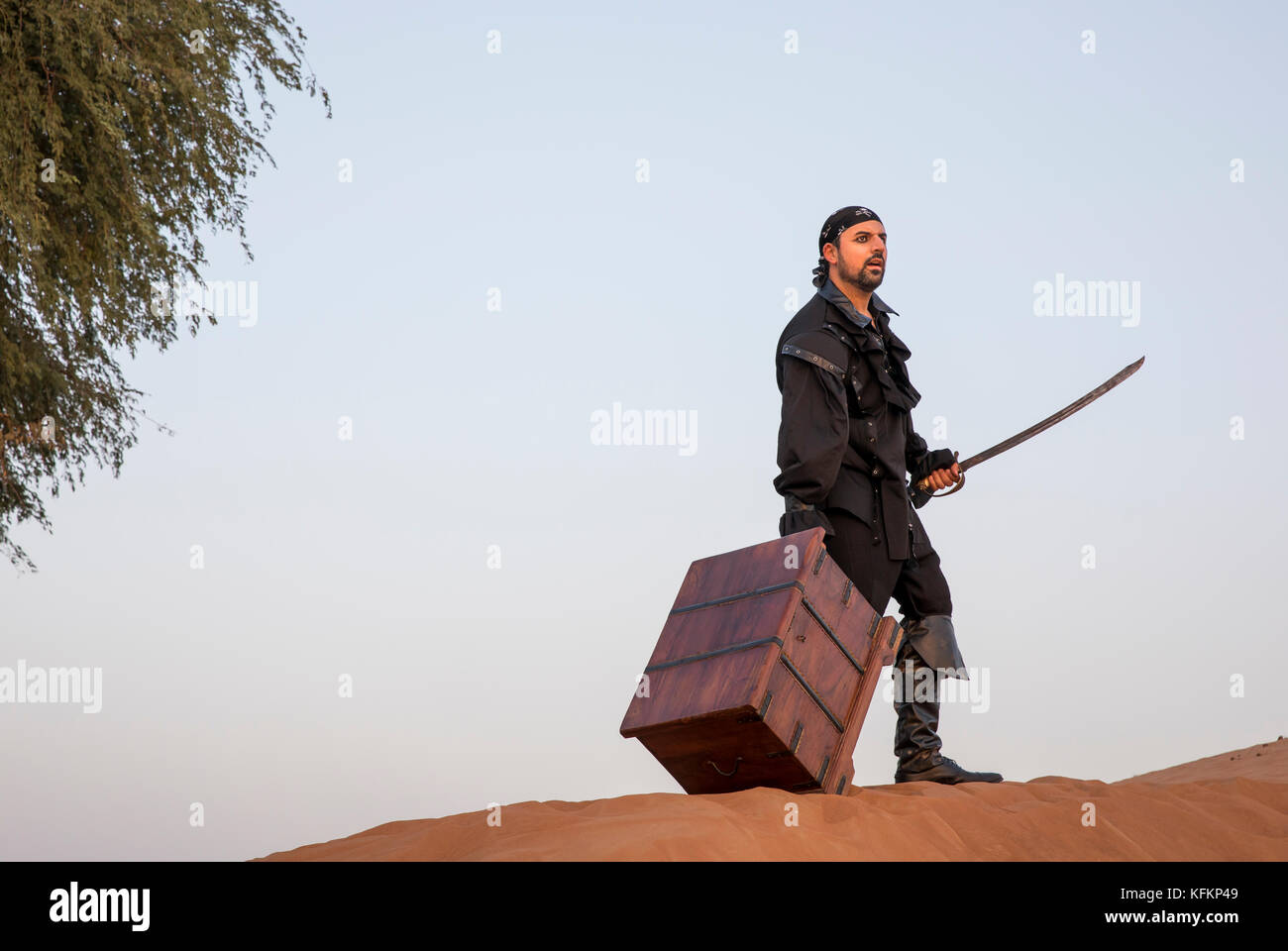 pirate with a treasure in a desert Stock Photo