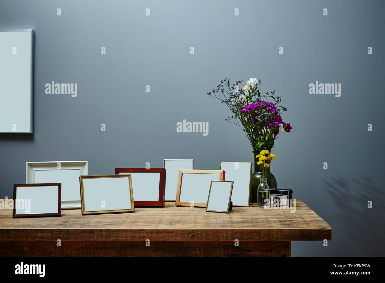 vintage sideboard with bunch of picture frames urban interior design