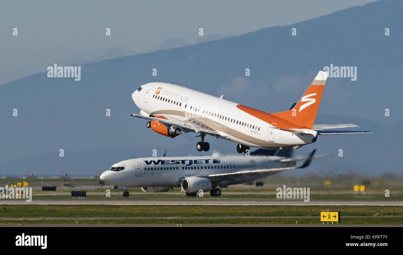 Richmond, British Columbia, Canada. 26th Oct, 2017. A Swift Air Boeing 737-400 (N802TJ) jet takes off from Vancouver International Airport. The airline, headquartered in Phoenix, Arizona, offers VIP, charter and cargo services. Credit: Bayne Stanley/ZUMA Wire/Alamy Live News Stock Photo