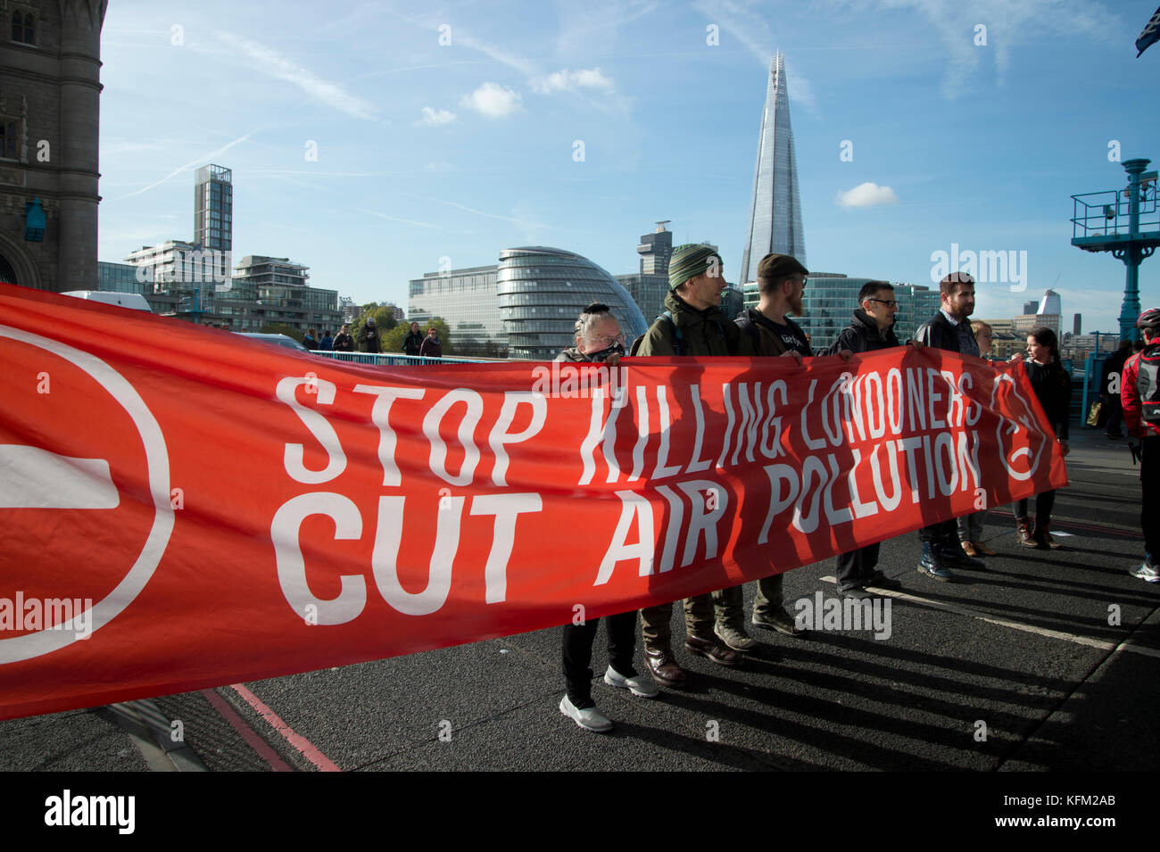 London, UK. 30th Oct, 2017. Action by Stop killing Londoners campaign to draw attention to the poor air quality of London and the effect of this on people's health. For one hour seven activists sat in the road on Tower Bridge, London, stopping traffic. Seven people were arrested. Credit: Jenny Matthews/Alamy Live News Stock Photo