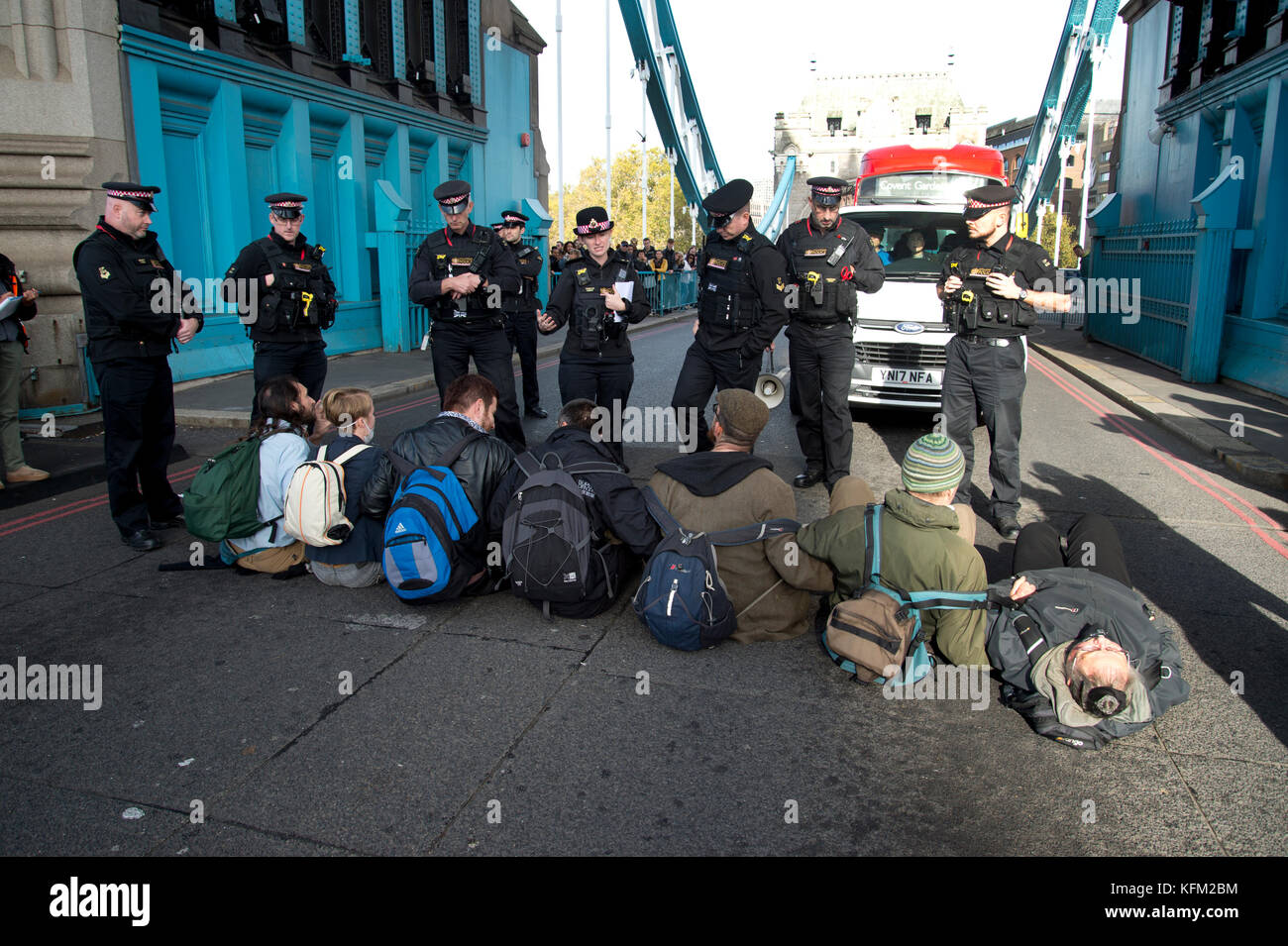 London, UK. 30th Oct, 2017. Action by Stop killing Londoners campaign to draw attention to the poor air quality of London and the effect of this on people's health. For one hour seven activists sat in the road on Tower Bridge, London, stopping traffic. Seven people were arrested. Credit: Jenny Matthews/Alamy Live News Stock Photo