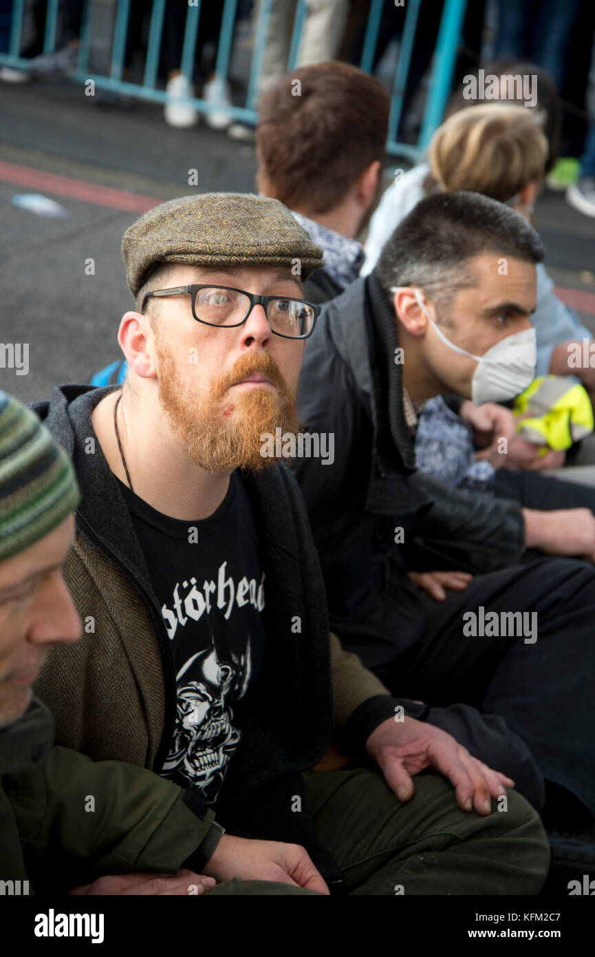 London, UK. 30th Oct, 2017. Action by Stop killing Londoners campaign to draw attention to the poor air quality of London and the effect of this on people's health. For one hour seven activists sat in the road on Tower Bridge, London, stopping traffic. Seven people were arrested. Credit: Jenny Matthews/Alamy Live News Stock Photo